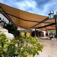 سایبان بازویی پارچه ای متحرک دستی برقی و چتر