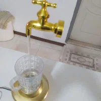 آب نما رو میزی طرح شیر آب