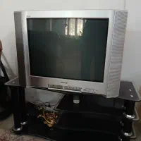تلویزیون به همراه میز