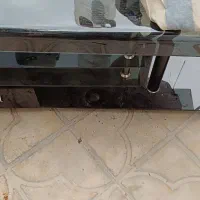 زیر تلویزیونی شیشه ای دارای کشو