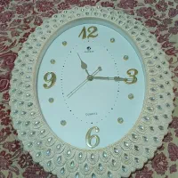 ساعت دیواری طرح صدف تمیزوسالم