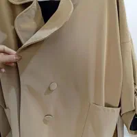 تعدای پالتو و لباس نو