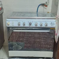 اجاق گاز فر دار دنیای صنعت‌ تمیز و  کاملا سالم