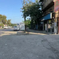 ملک-تجاری-مسکونی-سنددار-با-مالکیت-9-باب-مغازه