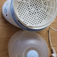 دستگاه استریل شیشه شیر و بخارپز تفال