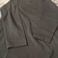 تعداد زیادی بلوز نخی مشکی