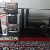 یک عدد زیر تلویزیون شیشه‌ای|میز تلویزیون|شیراز, جانبازان|دیوار
