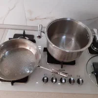 تعدادی قابلمه و ماهی تابه استیل