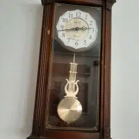 ساعت دیواری چوبی آونگ دار