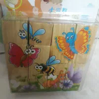 عروسک حمام و تویوپ و ساعت و پازل مکعب چوبی.