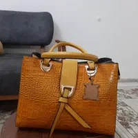 کیف چرم خردلی رنگ نو و استفاده نشده کادویی هست