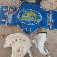 لباس و هوگو تکواندو به همراه کلاه و کاپ