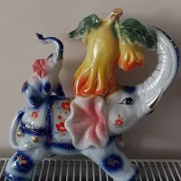 دکوری مجسمه فیل چینی و خانم چینی
