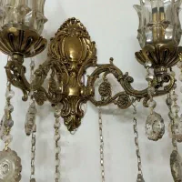 یک عدد دیوار کوب بزرگ و برنزی