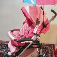 کالسکه صورتی مدل everflo  دسته عصایی
