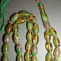 تسبیح کهربا پرچمی سبز