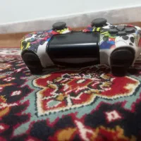 دسته‌ی پی اس فور با روکش و سیم شارژر
