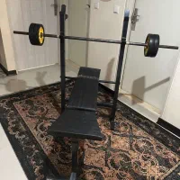 میز پرس سینه و ۶۰ کیکو وزنه