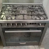 گاز طرح فر روکش روی گاز استیل همراه وسایل سالم