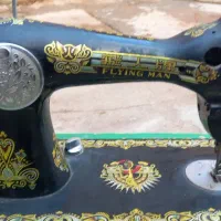 چرخ خیاطی مرد پرنده|چرخ خیاطی و ریسندگی|مسجد سلیمان, |دیوار