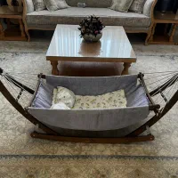 گهواره ی نوزاد همراه پشه بند