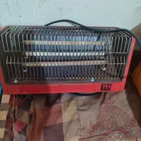 بخاری برقی چمدان گل و گلدان و لوستر