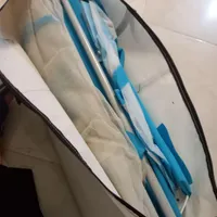یه گهواره در حد نو و آغوشی بچه و کیسه خواب