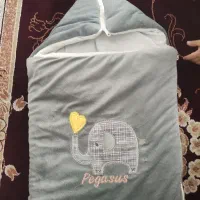 کیسه خواب و آغوشی نوزاد