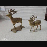 دو تا مجسمه گوزن طلایی