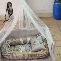 گهواره کنار مادر