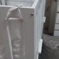تخت  گهواره ای  کنار  مادر