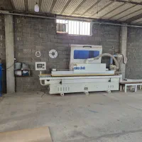 دستگاه لبه چسبان و پنل بر در کارگاه برشکاری