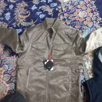 کاپشن نو به علت جمع کردن مغازه|لباس|بابل, |دیوار