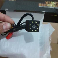 دوربین دنده عقب.ودوعدد پنل دکوراتیو طرح چوب ومشکی