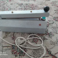 دستگاه دوخت و پرس بسته بندی