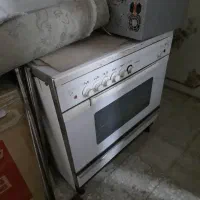 تلویزیون سونی و میز تلویزیون فرش و کمد و گاز فردار