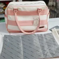 ساک و کیف چرم نوزاد برند کوکالو طرح راه راه(صورتی)