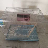 قفس پرنده به همراه نی و لونه و جای آب