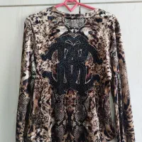 تعدادی شومیز و مانتو مجلسی