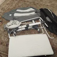 گهواره کنار تختی مادر