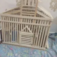 یک قفس چوبی دستی خوشکل