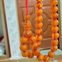 یک عدد تسبیح کهربای استاد ناصر بهمنی