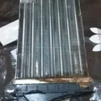 تعداد  ۲ عدد فنرعقب  اصلی تیبا و یکعدد بخاری ۲۰۷