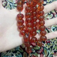 تسبیح کهربا پرچمی دست خورد
