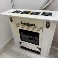 بخاری مدل شومینه و کودک