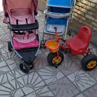 دو عدد کالسکه کم جا و سه چرخه بچگانه