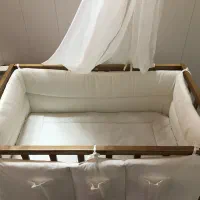 تخت نوزادی کنار مادر