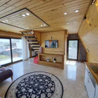 کلبه سوئیسی تک خواب با جکوزی۲نفره تراس دارلب ساحل|اجارهٔ کوتاه‌مدت ویلا و باغ|بندر انزلی, اطبا|دیوار