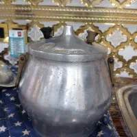 یک عددزودپز|ظروف پخت‌وپز|شوشتر, |دیوار