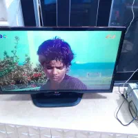 تلویزیون LENOVO و یک عدد میز تلویزیون